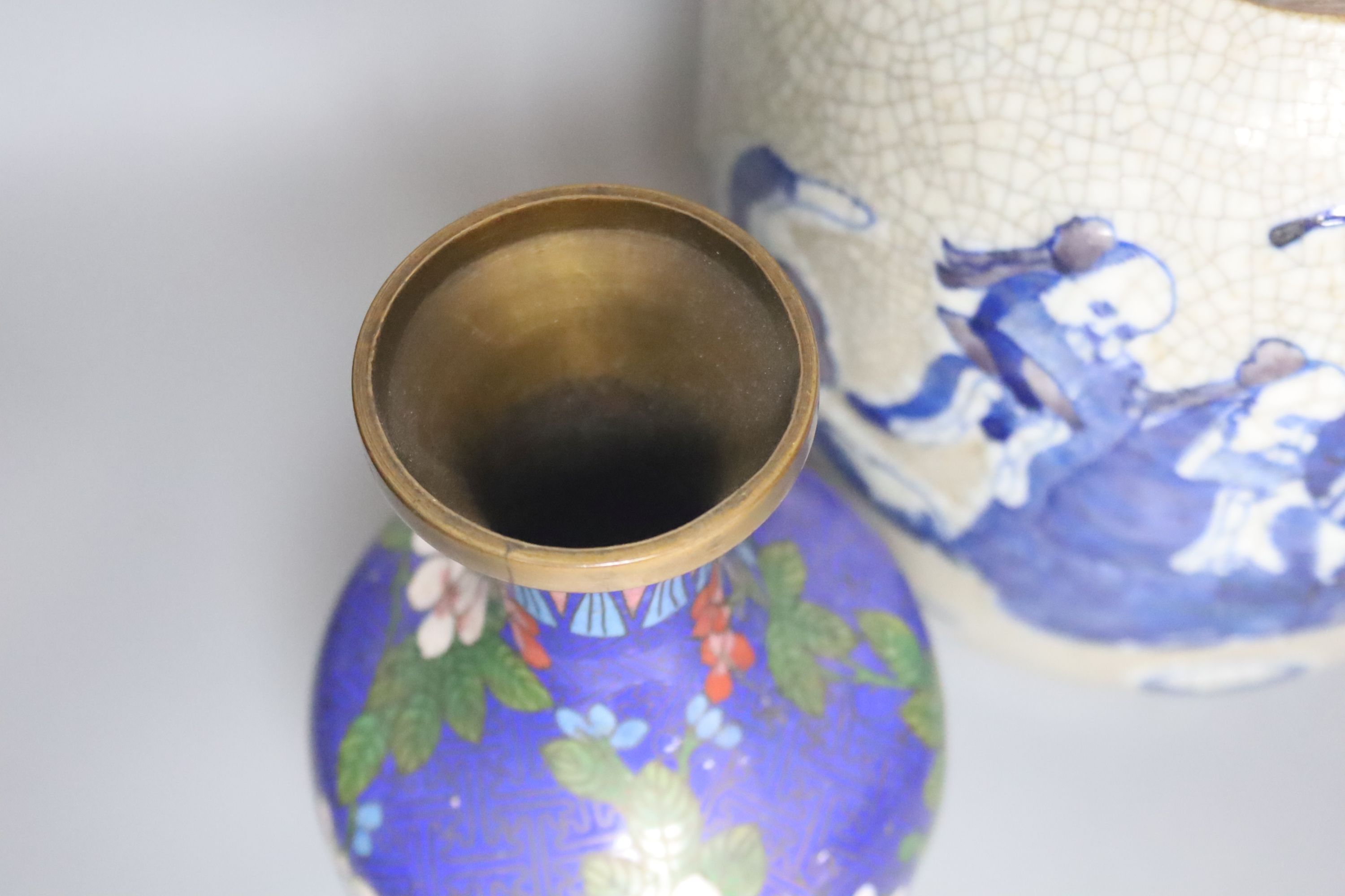 A Chinese blue and white crackle glaze vase, a similar cloisonne vase and a bronze vase, tallest 38cm